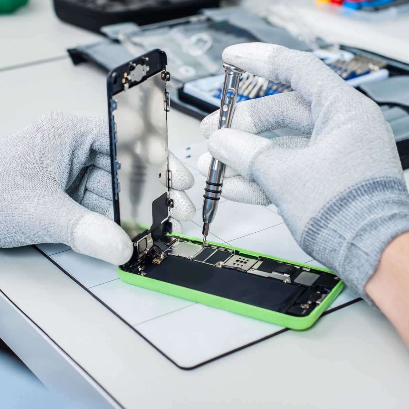 dreamstime_m_61356877 Process of mobile phone repair. Close-up photos showing process of mobile phone repair