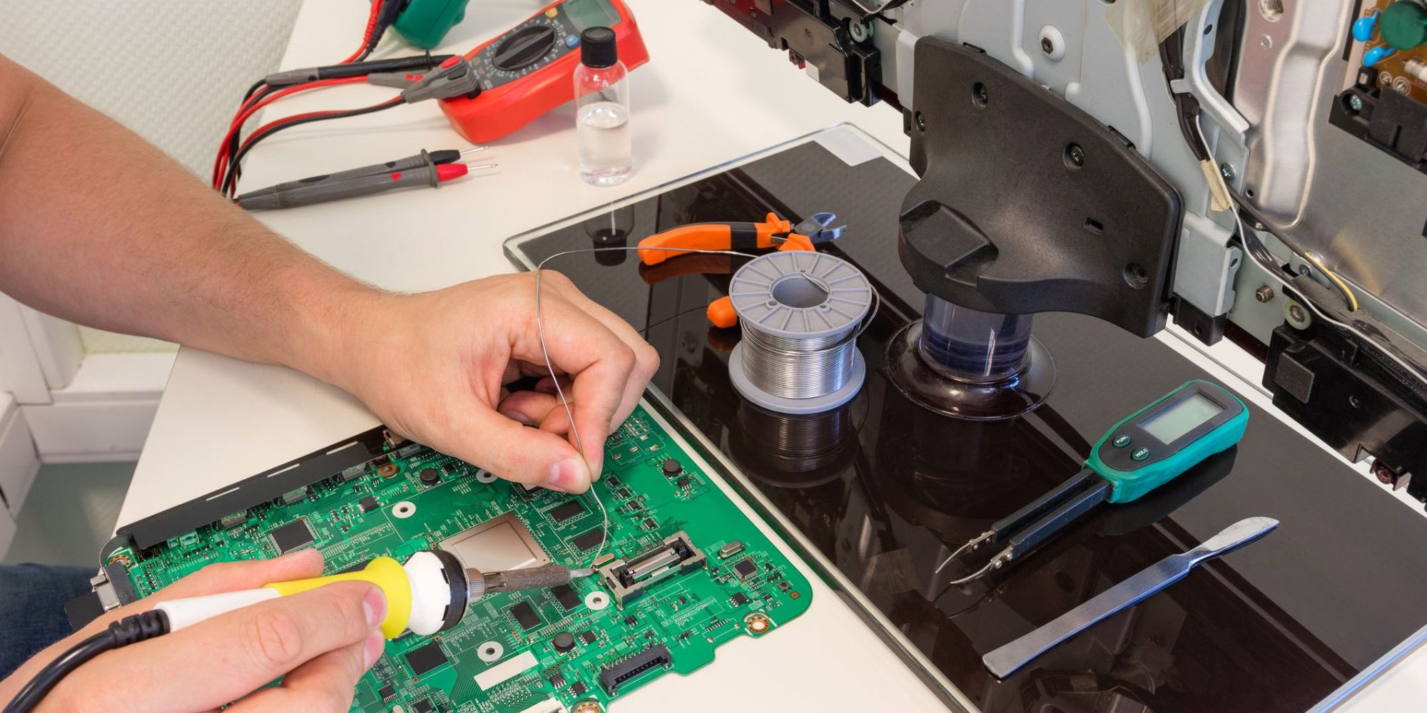 dreamstime_m_98794998 Chip and TV repair, Repair of modern electronics. High quality photo